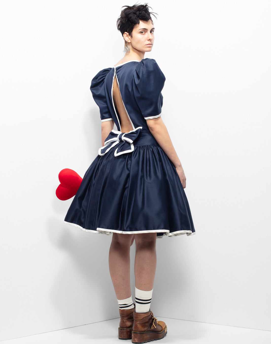 Vintage sartorial navy blue baloon dress with white trim and bow on back