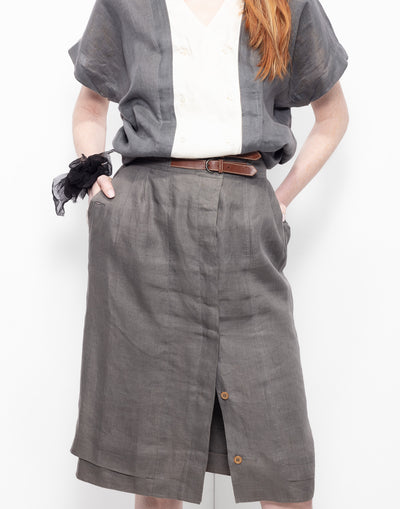 High-waisted gray linen skirt with leather belt as an insert from Gucci archives